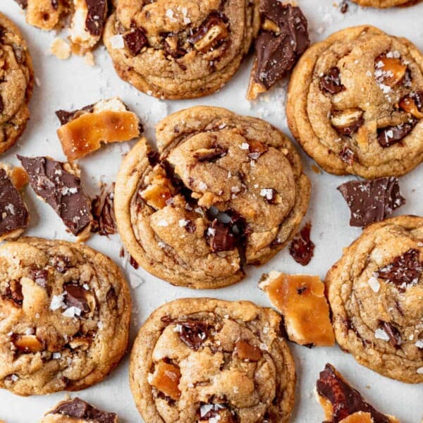 brown butter toffee cookies cooling on parchment paper
