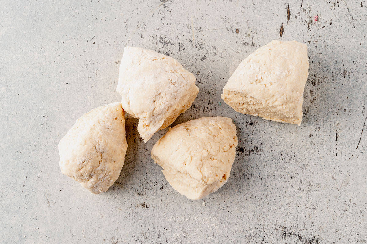 bagel dough divided into four equal pieces