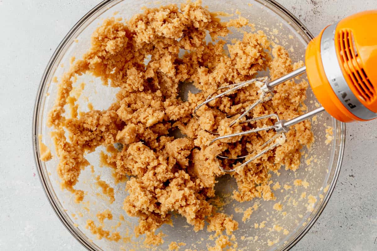 butter, brown sugar, and white sugar beaten in a mixing bowl