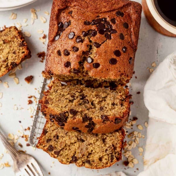 two slices of oat flour banana bread cut from the loaf