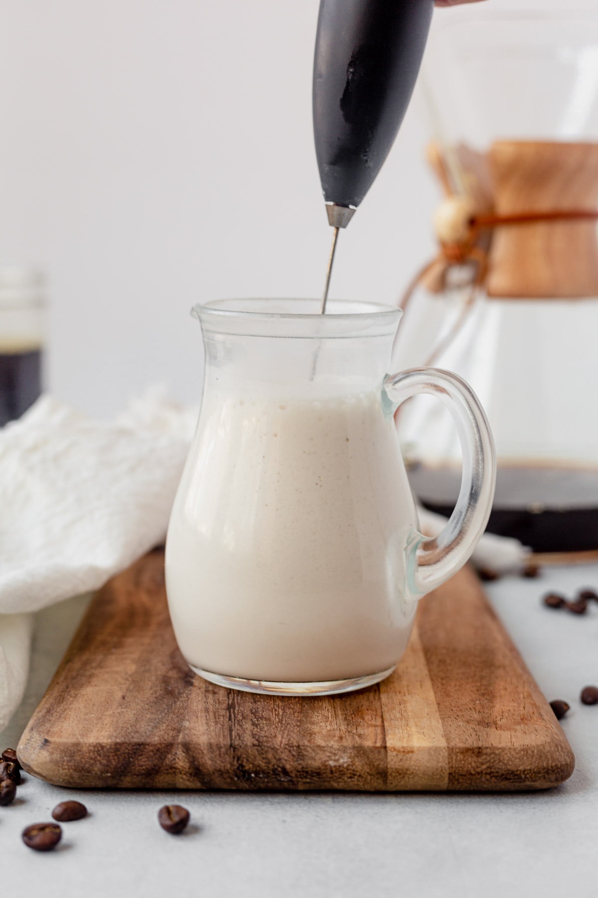 blending vanilla sweet cream cold foam with a handheld frother